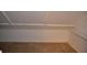 Small attic space with carpeted floor and shelving at 242 Orienta Point St # 242, Altamonte Springs, FL 32701