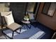 Small balcony with two chairs, a table, and a patterned rug at 242 Orienta Point St # 242, Altamonte Springs, FL 32701