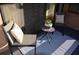 Small balcony with two chairs, a table, and a patterned rug at 242 Orienta Point St # 242, Altamonte Springs, FL 32701