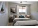 Cozy bedroom featuring a comfortable bed, stylish decor, and a well-lit window at 242 Orienta Point St # 242, Altamonte Springs, FL 32701
