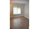 Bright bedroom with hardwood floors, large window, offering great natural light at 242 Orienta Point St # 242, Altamonte Springs, FL 32701