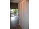 Hallway with white louvered doors and sliding glass door to patio at 242 Orienta Point St # 242, Altamonte Springs, FL 32701