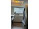 Modern kitchen with stainless steel appliances and light wood floors at 242 Orienta Point St # 242, Altamonte Springs, FL 32701