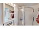 Bright bathroom with shower stall, mirror, and storage at 2514 E Marks St, Orlando, FL 32803