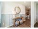 Entryway with console table, mirror and striped ottomans at 2592 Kinsale Ln, Ormond Beach, FL 32174