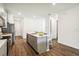 Modern kitchen island with white countertops and stainless steel appliances at 2592 Kinsale Ln, Ormond Beach, FL 32174