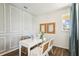 Bright home office with white table and natural light at 2592 Kinsale Ln, Ormond Beach, FL 32174