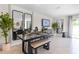 Modern dining area with a sleek dining table and bench seating at 2917 Hudson Hammock Way, Saint Cloud, FL 34773