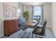 Bright home office features a large desk, comfortable chairs, and ample natural light at 2917 Hudson Hammock Way, Saint Cloud, FL 34773