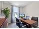 Well-lit home office with a desk, chairs, and a view at 2917 Hudson Hammock Way, Saint Cloud, FL 34773