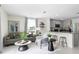 Open concept living room with kitchen access and neutral decor at 2917 Hudson Hammock Way, Saint Cloud, FL 34773