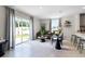 Comfortable living room featuring a large sliding glass door leading to backyard at 2917 Hudson Hammock Way, Saint Cloud, FL 34773