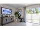Living area with sliding glass doors leading to the backyard at 2917 Hudson Hammock Way, Saint Cloud, FL 34773