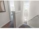 View of carpeted stairs and hallway with bedroom at 2917 Hudson Hammock Way, Saint Cloud, FL 34773