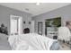 Bedroom with large bed, home office and TV at 3361 S Kirkman Rd # 811, Orlando, FL 32811