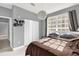 Bedroom with large window, closet, and brown bedding at 3361 S Kirkman Rd # 811, Orlando, FL 32811