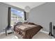Spacious bedroom with large window and brown bedding at 3361 S Kirkman Rd # 811, Orlando, FL 32811