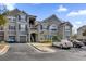 Condo building exterior with parking and landscaping at 3361 S Kirkman Rd # 811, Orlando, FL 32811