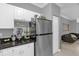 Kitchen features stainless steel refrigerator and white cabinets at 3361 S Kirkman Rd # 811, Orlando, FL 32811