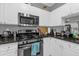 Modern kitchen with stainless steel appliances and granite countertops at 3361 S Kirkman Rd # 811, Orlando, FL 32811