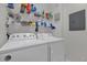Laundry room with washer and dryer, and storage shelves at 3361 S Kirkman Rd # 811, Orlando, FL 32811