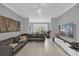 Spacious living room with sectional sofa and large TV at 3361 S Kirkman Rd # 811, Orlando, FL 32811