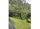 Private backyard with lush green space and trees at 3757 Conroy Rd # 2525, Orlando, FL 32839