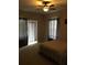 Spacious bedroom with carpeted floors and ceiling fan at 3757 Conroy Rd # 2525, Orlando, FL 32839