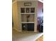 Built-in shelving unit with decorative items and storage space at 3757 Conroy Rd # 2525, Orlando, FL 32839