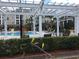 Relaxing community pool with pergola and lounge chairs at 3757 Conroy Rd # 2525, Orlando, FL 32839