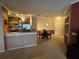 Open-concept living area with kitchen, dining space, and neutral decor at 3757 Conroy Rd # 2525, Orlando, FL 32839