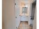 Clean bathroom with single sink vanity and tile flooring at 4465 Ne 2Nd Ct, Ocala, FL 34479