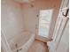 Bathroom with a large tub and shower at 4465 Ne 2Nd Ct, Ocala, FL 34479