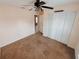 Bright bedroom with ceiling fan and double door closet at 4465 Ne 2Nd Ct, Ocala, FL 34479
