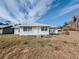 House exterior with yard, steps and front door at 4465 Ne 2Nd Ct, Ocala, FL 34479