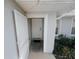 Front entrance with a white door and storm door at 4465 Ne 2Nd Ct, Ocala, FL 34479