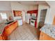 Spacious kitchen with ample cabinetry, granite countertops, and tile flooring at 4465 Ne 2Nd Ct, Ocala, FL 34479