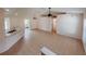 Open living room and kitchen with tile floors and vaulted ceiling at 4465 Ne 2Nd Ct, Ocala, FL 34479