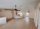 Open living room and kitchen with tile floors and vaulted ceiling at 4465 Ne 2Nd Ct, Ocala, FL 34479