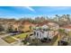 Aerial view of two-story house with tile roof, driveway, and landscaping at 4524 Stella St, Kissimmee, FL 34746