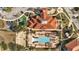 Aerial view of community pool, clubhouse, playground, and parking at 4524 Stella St, Kissimmee, FL 34746