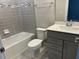 Well-appointed bathroom with tiled shower, modern vanity, and a comfort height toilet at 4535 Gliding Wave St, Winter Garden, FL 34787