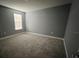 Comfortable bedroom featuring carpet flooring, a window, and freshly painted walls at 4535 Gliding Wave St, Winter Garden, FL 34787