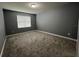 Bedroom featuring gray walls, carpet floors and window with blinds at 4535 Gliding Wave St, Winter Garden, FL 34787