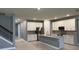 Spacious kitchen with an island, stainless steel appliances, and white cabinets, offering ample cooking and storage space at 4535 Gliding Wave St, Winter Garden, FL 34787