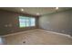 Spacious living room featuring wood flooring, a bright window and recessed lighting at 4535 Gliding Wave St, Winter Garden, FL 34787