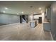 Spacious living room featuring tile flooring, neutral paint, and a modern kitchen island at 4535 Gliding Wave St, Winter Garden, FL 34787