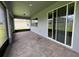 Covered outdoor patio featuring brick flooring, lots of space, and lots of light at 4535 Gliding Wave St, Winter Garden, FL 34787