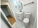 Modern bathroom with white vanity, shiplap walls, and marble-look flooring at 4732 Lighthouse Cir, Orlando, FL 32808