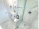 Modern bathroom with white tile, walk-in shower, and updated vanity at 4732 Lighthouse Cir, Orlando, FL 32808